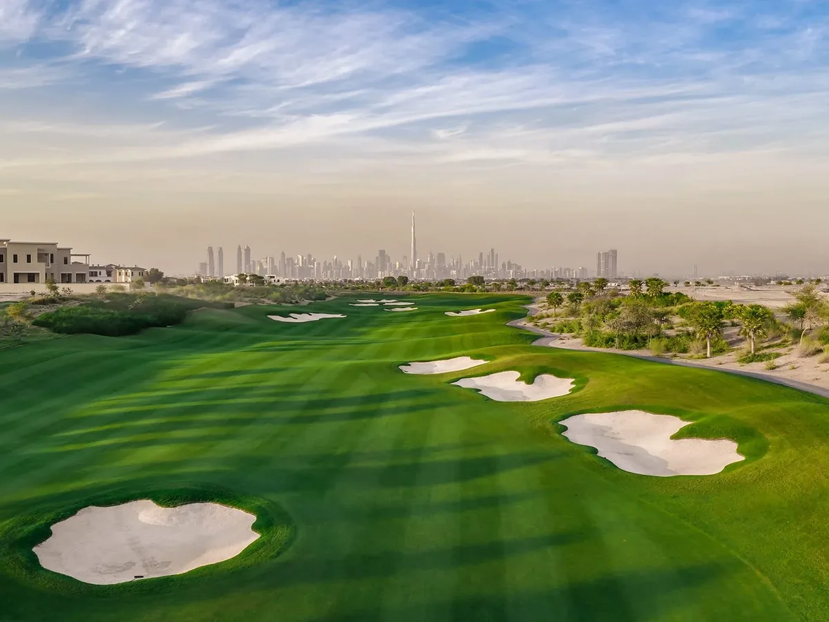 Golf fairway with the Dubai skyline and Burj Khalifa in the distance